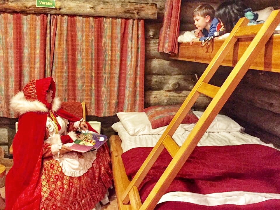 Mrs. Clause Reading To Children in Lapland