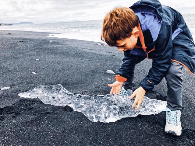 Inspecting Ice Diamond Beach Iceland